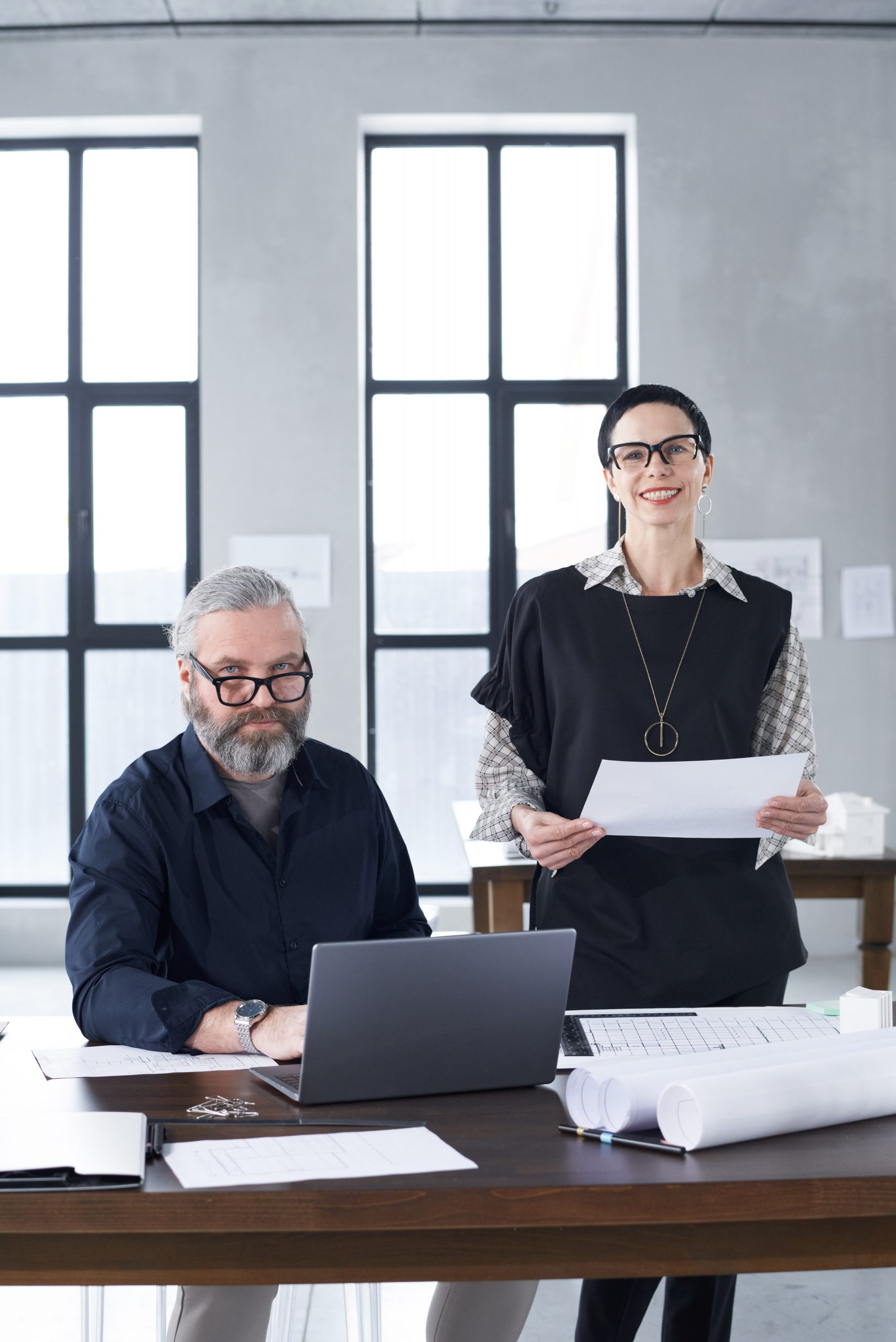experienced architects working with blueprints 2021 09 01 11 20 44 utc scaled