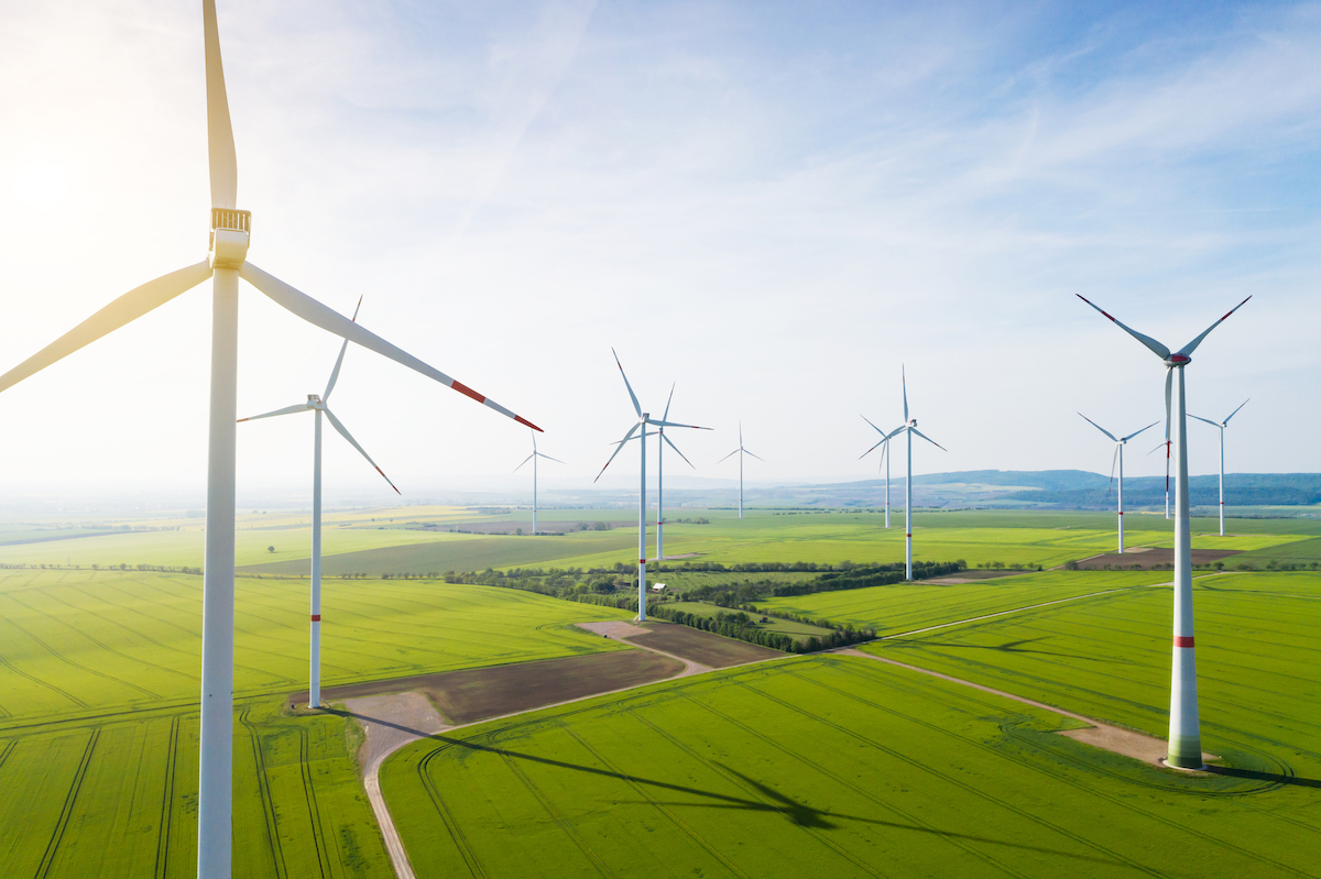 Aerial view of wind turbines and agriculture field medio ambiente